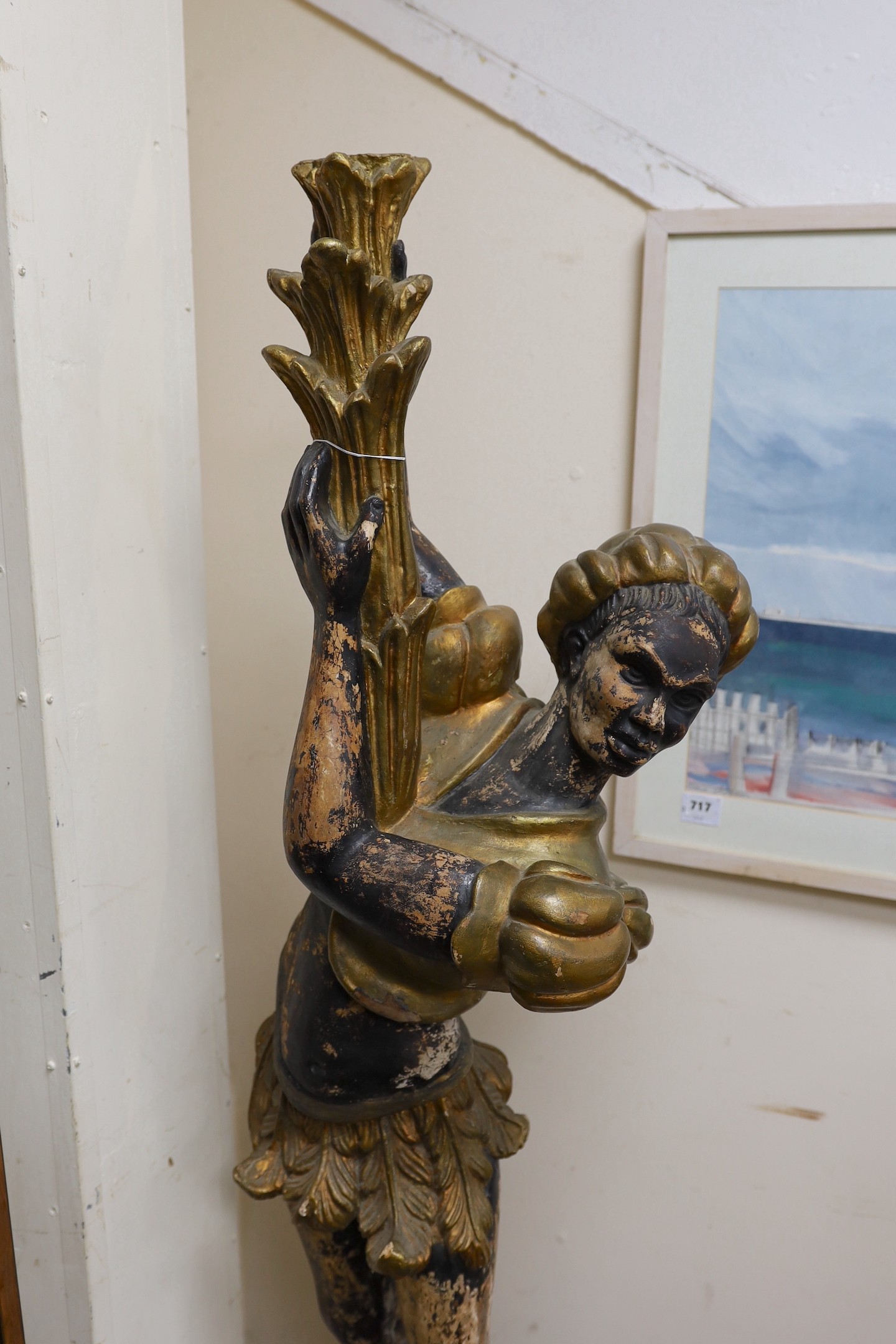 A floor standing composition blackamoor, 177cms high